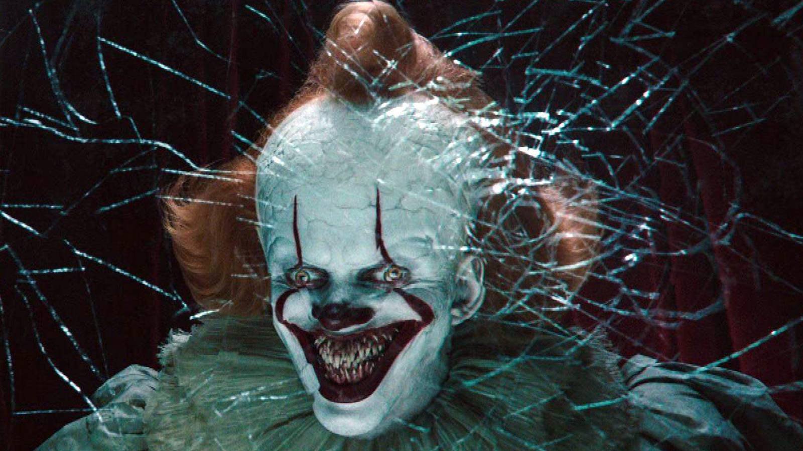 Pennywise with a horrifying grin on his face in It Chapter Two