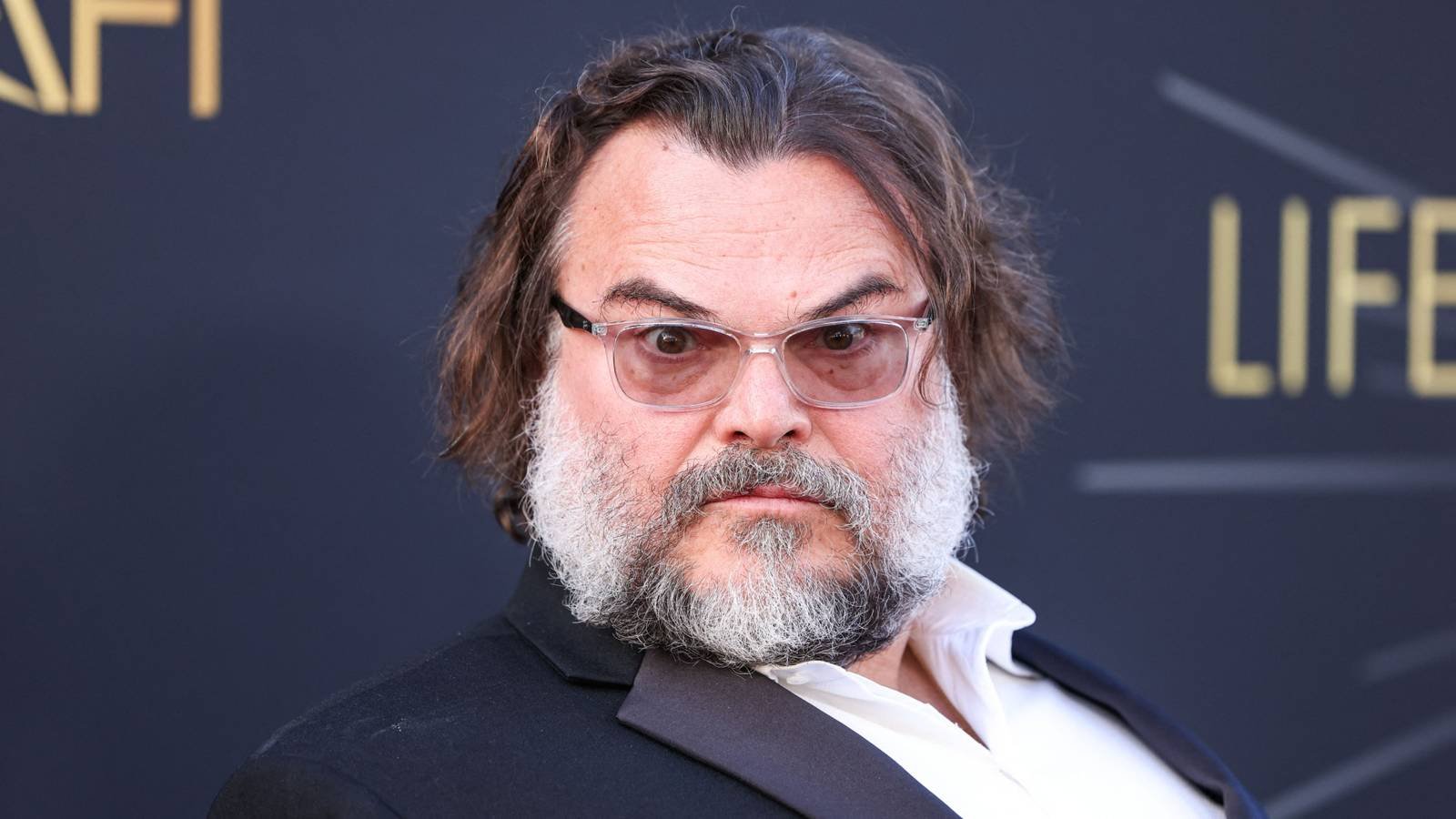 Jack Black looks at the camera on the red carpet