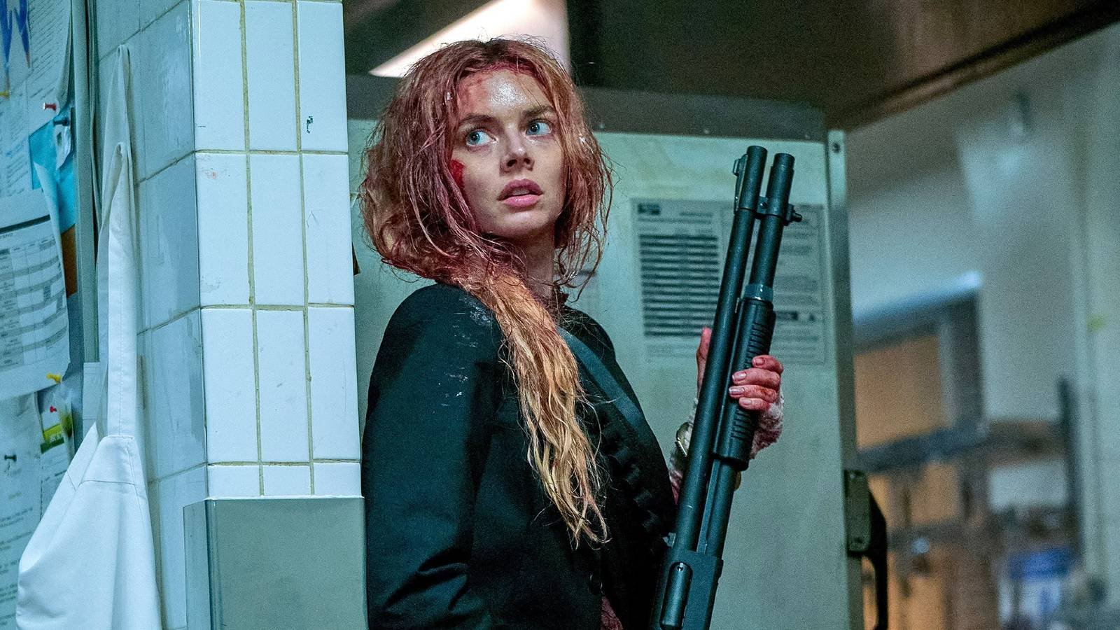 Samara Weaving holding a shotgun as Grace in Ready or Not 2 Here I Come