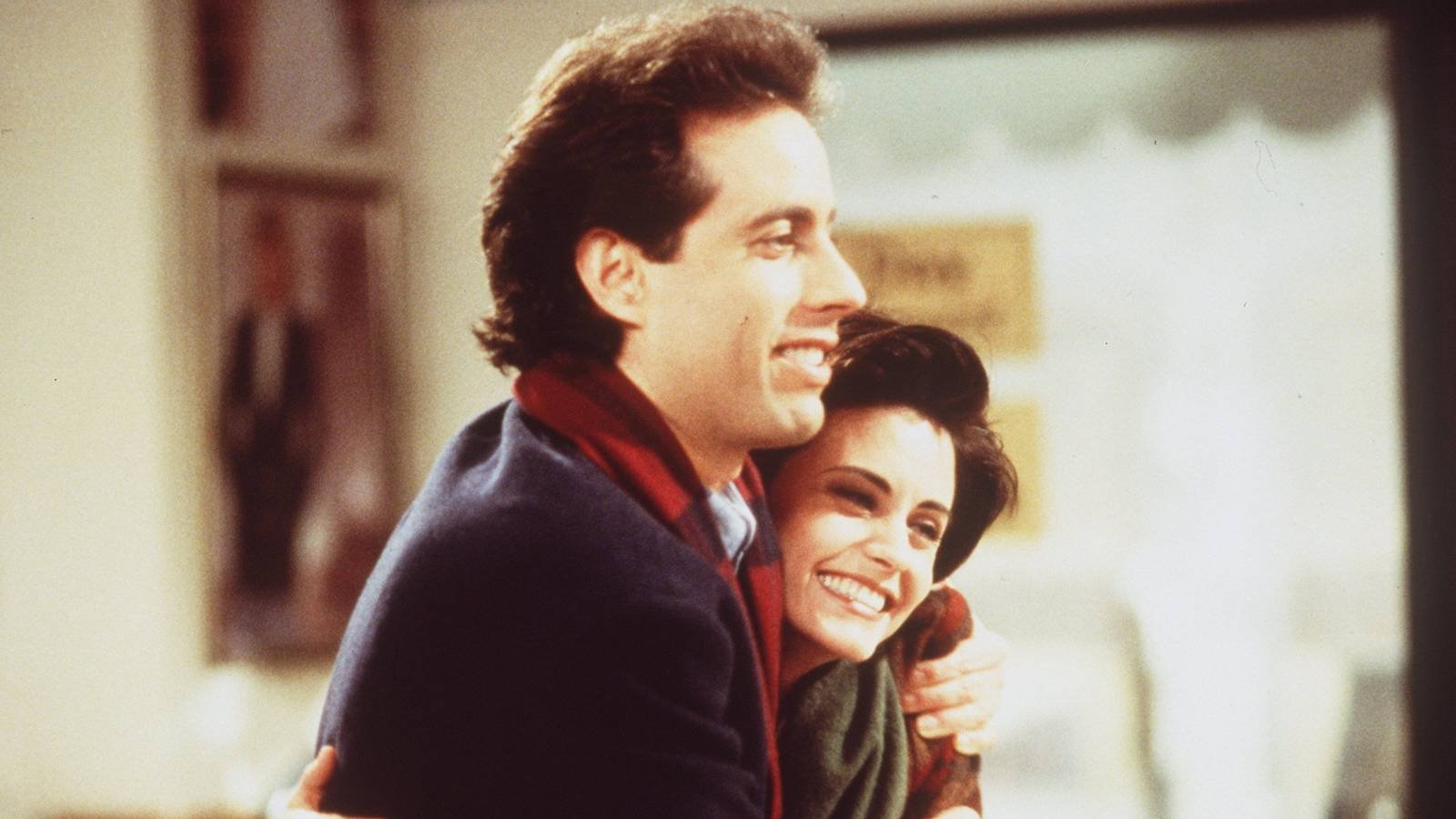 Jerry Seinfeld and Courteney Cox hugging in Seinfeld