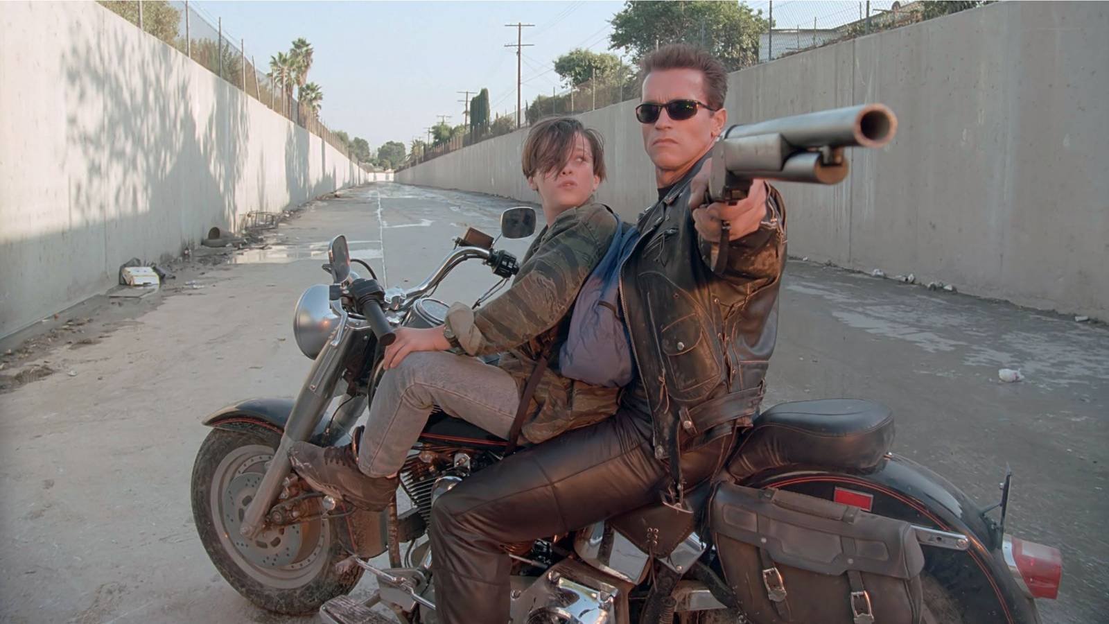 Arnold Schwarzenegger as the T-800 with Edward Furlong as John Connor in Terminator 2