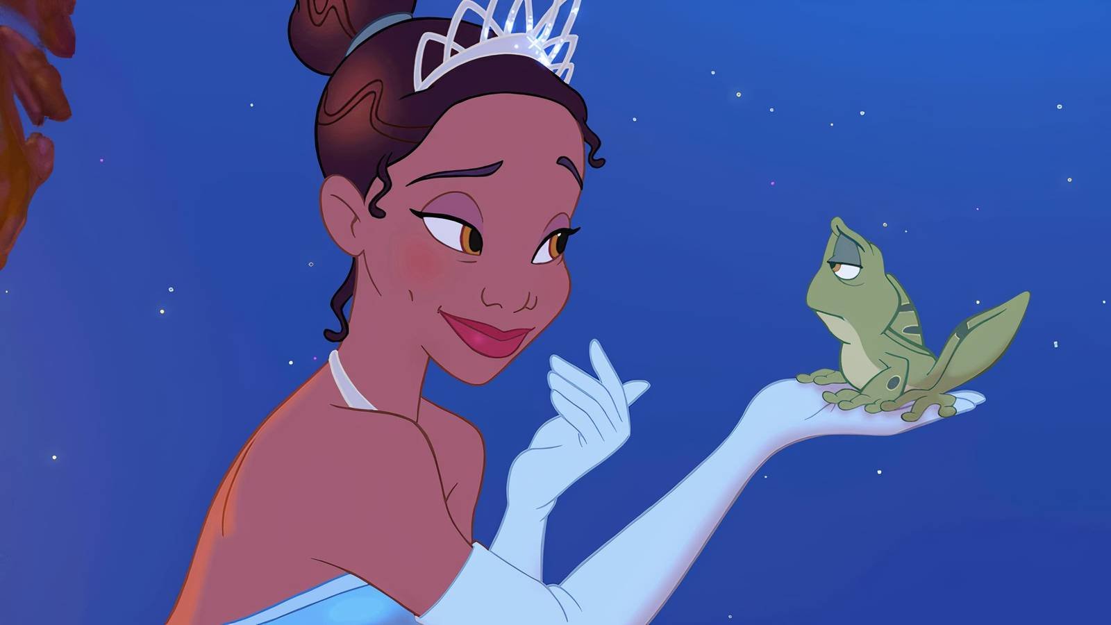 Tiana holds up a frog in The Princess and the Frog