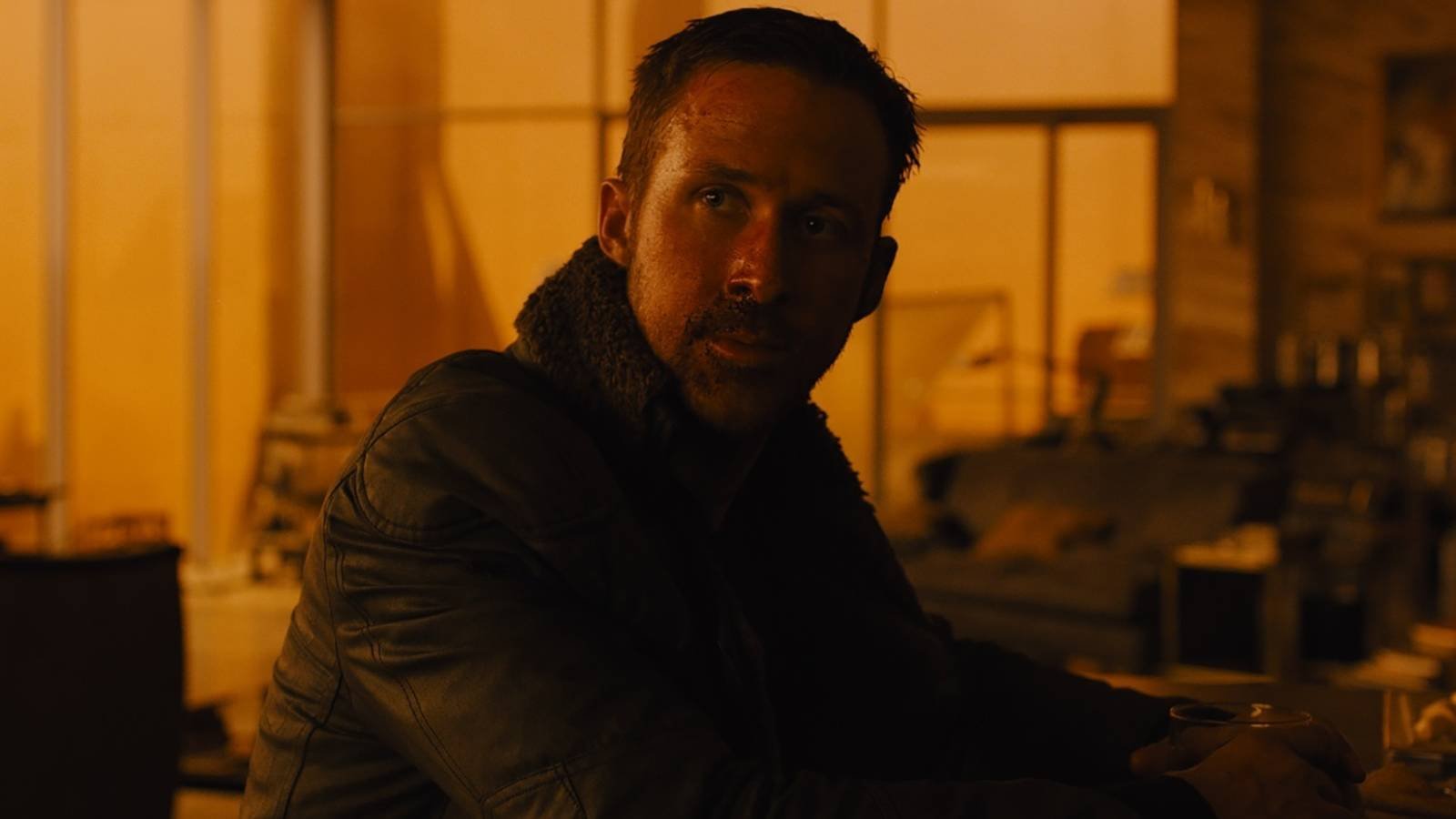 Ryan Gosling looking up in Blade Runner 2049